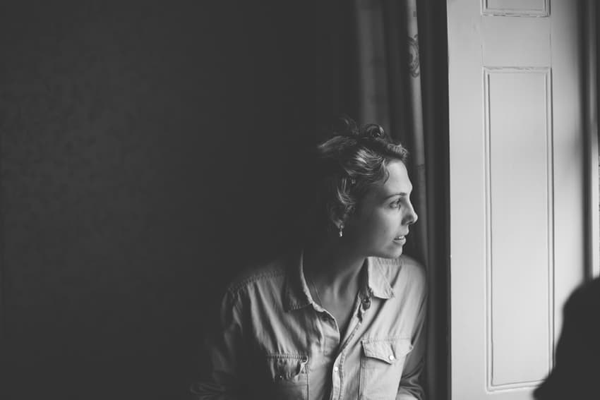 Bride looking out of window