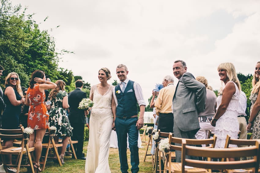 Bride and groom walking away