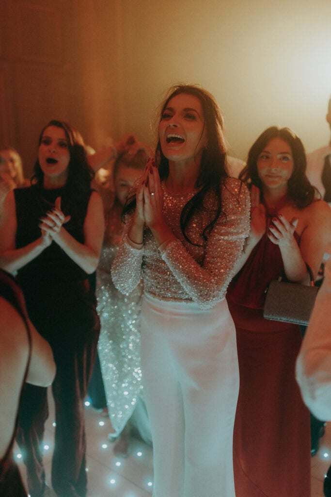 Nadine Merabi wedding jumpsuit at Claridges Hotel winter wedding in Mayfair London